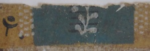 Detail of a plant sprig on a fragment of wallpaper from the Morris-Jumel Mansion.
