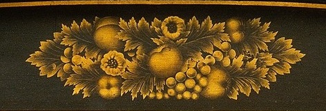 Detail of stenciling on an American Empire secretary-bookcase at the Metropolitan Museum.