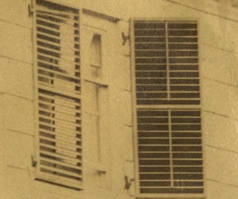 Detail of a photograph of the Morris-Jumel Mansion showing a pair of venetian blinds in a window circa 1860.