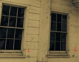 Photograph of the exterior of the Morris-Jumel Mansion showing shutter dogs (also called shutter holdbacks) used to hold window shutters open.