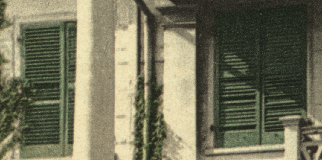 Detail of a postcard showing two windows of the Morris-Jumel Mansion with venetian blinds in 1903.
