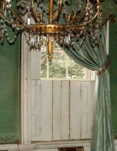 Photograph of the lower shutters of a parlor window in the Morris-Jumel Mansion, shown in closed position.