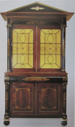 Photograph of a signed bookcase by Robert Fisher. 